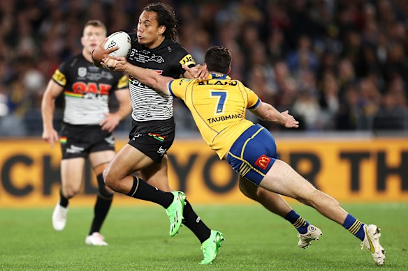 Jarome Luai is tackled by new NSW teammate Mitchell Moses during the 2022 NRL grand final.