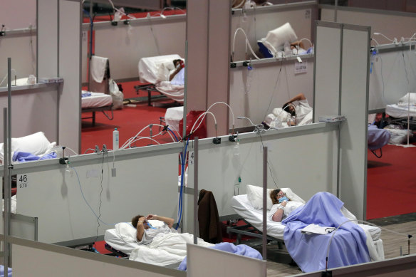 Patients at a temporary field hospital in the Ifema convention centre in Madrid, Spain.