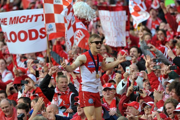 Kieren Jack laps up the glory after Sydney's 2012 AFL grand final win.
