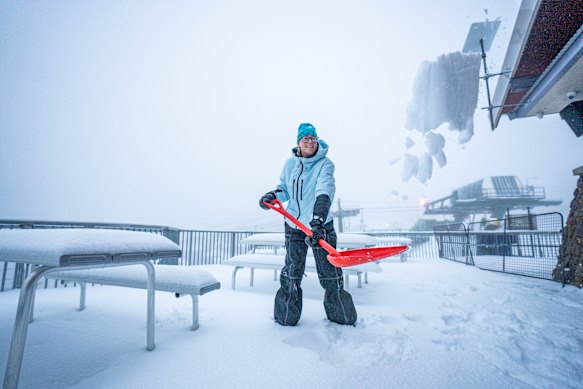 Claire Talbot, Vail Resorts brand and experience seasonal coordinator, celebrates the snowy scenes at Hotham this week ahead of the opening weekend.