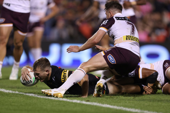 Mitch Kenny of the Panthers scores a try during the round three NRL match.