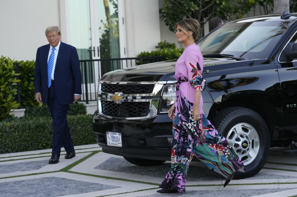 Former President Donald Trump arrives with Melania Trump for a fundraiser in Palm Beach.