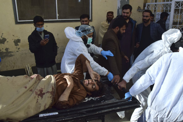 Rescue workers transport a bomb-blast victim to a hospital in Quetta, Pakistan.