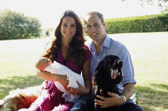 The Duchess of Cambridge and  Duke of Cambridge pose with Prince George and Lupo in 2013.