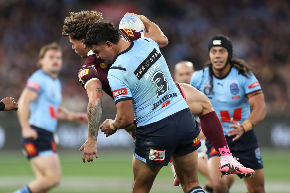 Mitchell slams Queensland superstar Reece Walsh at the MCG on Wednesday.