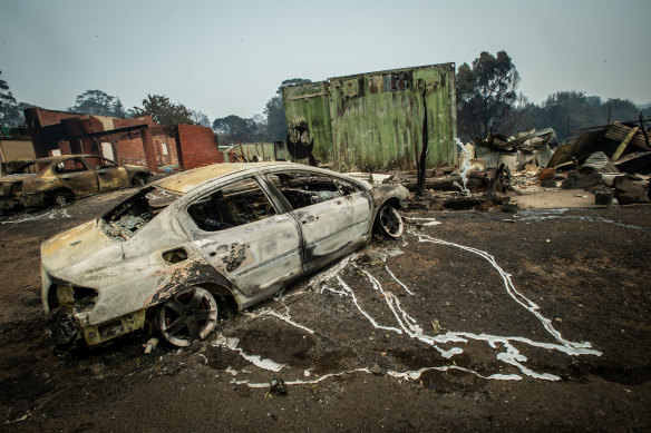 A burned car at Lake Conjola after last night's bushfires.