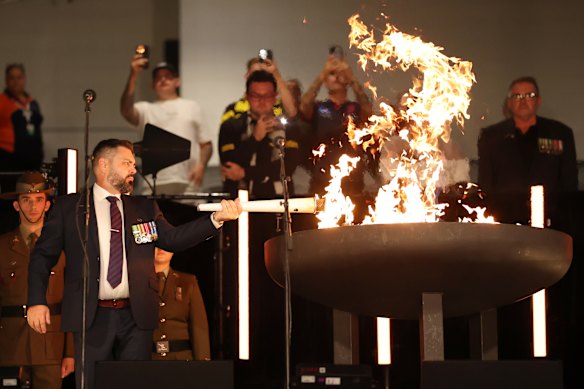 Paul Warren lit the eternal flame ahead of Melbourne’s Anzac Day eve clash with Richmond.