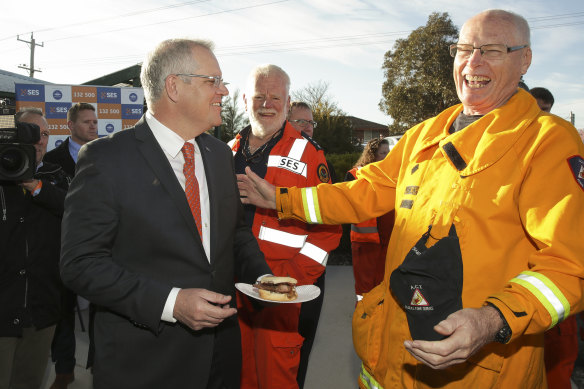 Former prime mnister Scott Morrison with the late senator Jim Molan during a visit to meet NSW SES and NSW Rural Fire Service volunteers in 2018.