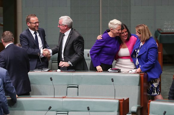 Crossbench MPs Adam Bandt, Andrew Wilkie, Kerryn Phelps, Julia Banks and Rebekha Sharkie celebrate after the medevac bill passes the House of Representatives.