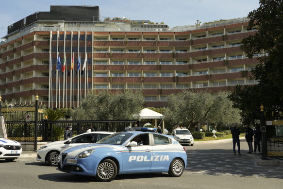 A police car leaves the Cavalieri Hilton hotel in Rome where US national security adviser Jake Sullivan and Chinese foreign minister Yang Jiechi met to talk about the situation in Ukraine.