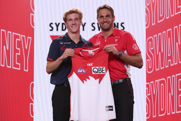 Dylan Stephens stands next to Swans veteran Josh Kennedy after being picked up by the Swans.