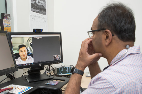 Dr Mukesh Haikerwal interviewing patient James via phone link before the test.