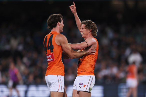 Jack Buckley and Lachie Whitfield celebrate the GWS Giants’ comfortable win over Port Adelaide.