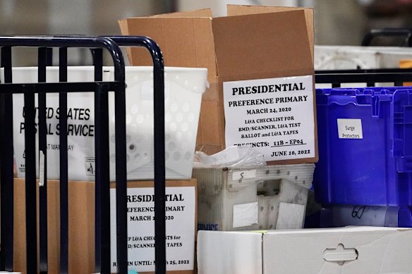 Absentee ballots stacked up at the Fulton County election center.