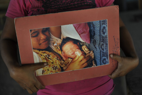 Pedro is pictured as a newborn child in the arms of his mother, Joanna.