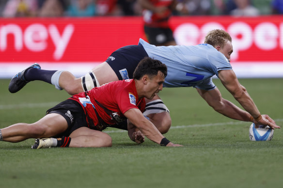 Hugh Sinclair goes over for the Waratahs