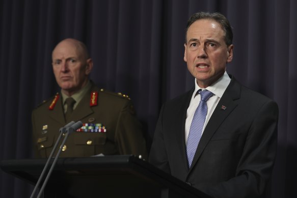 COVID-19 Taskforce Commander, Lieutenant General John Frewen and Minister for Health and Aged Care Greg Hunt during a press conference at Parliament House in Canberra yesterday.
