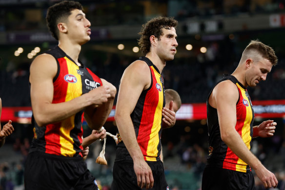 Max King (centre) walks off with dejected Saints teammates after their loss to the Dockers.