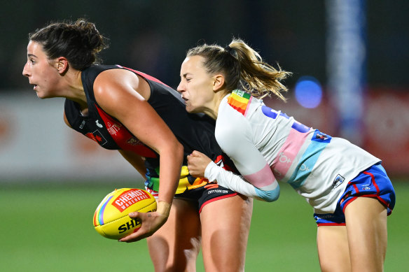 Essendon’s Ashleigh Van Loon is tackled.