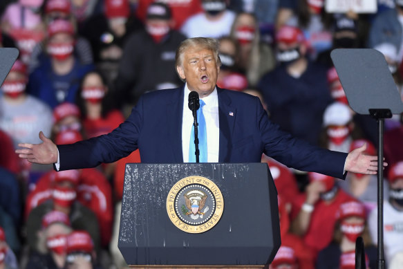 President Donald Trump speaks during a campaign rally at Harrisburg International Airport in September. The President's campaign has been virtually halted overnight by his diagnosis with coronavirus.  