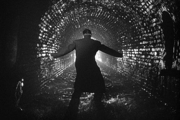 Orson Welles as an on-the-run Harry Lime in a scene depicting the Vienna sewers.