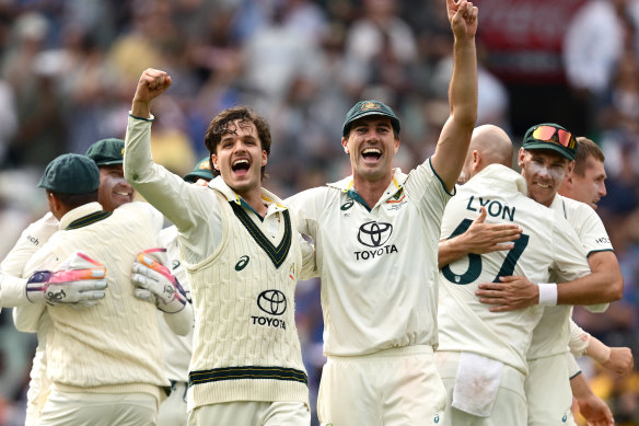 Sam Konstas and Pat Cummins celebrate Australia’s victory on Monday.