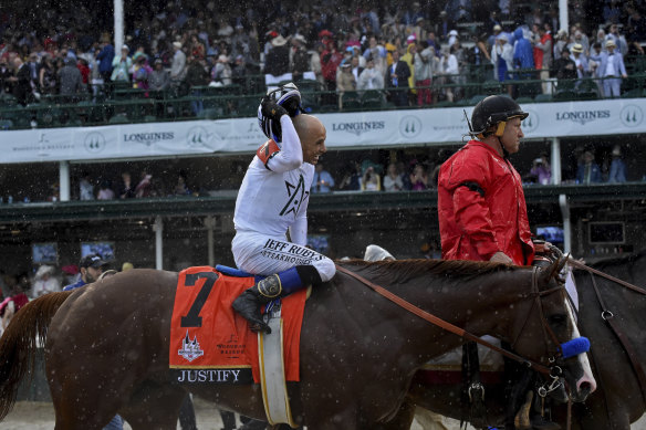 Jockey Mike Smith smiles after the Kentucky Derby victory on Justify in 2018.