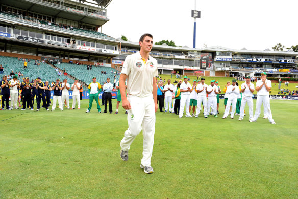 Cummins winning the man of the match award on his Test debut, against South Africa in 2011.