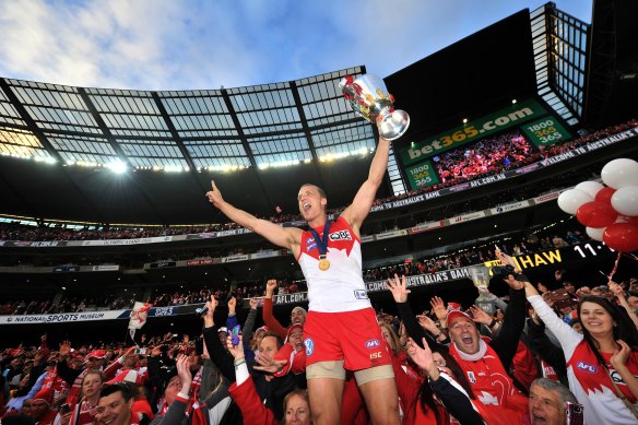 Ted Richards holds the trophy aloft after the Swans’ 2012 grand final victory.