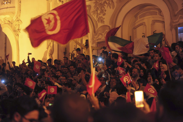 A crowd gathers on Tunis' main avenue on Sunday to celebrate Kais Saied's election.