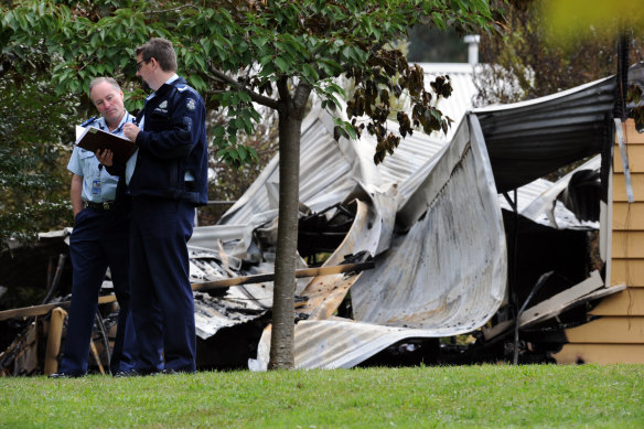 Police officers at the scene of the fatal house fire in Zig Zag Road, Mount Macedon in March 2010.