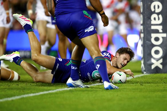 Luke Metcalf gets the ball down for a try.