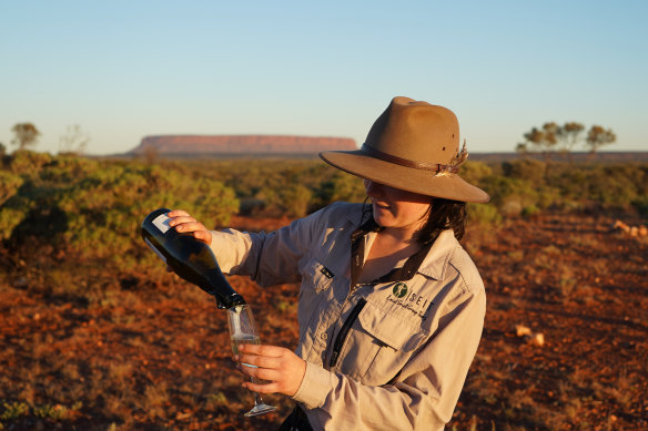 Guide Hayley Pope pours sundowners. 