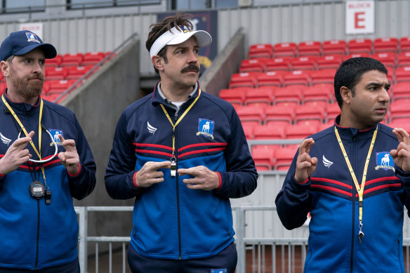 Brendan Hunt, Jason Sudeikis and Nick Mohammed in <i>Ted Lasso</i>, the second season of which sees the soccer team relegated to the second tier of the English football competition.