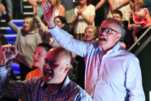 Prime Minister Scott Morrison and wife Jenny sing during an Easter Sunday service at his Horizon Church in Sydney during the 2019 election campaign.