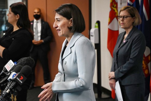 Premier Gladys Berejiklian, with Chief Health Officer Kerry Chant (right), announced a relaxation of COVID-19 restrictions on Monday.