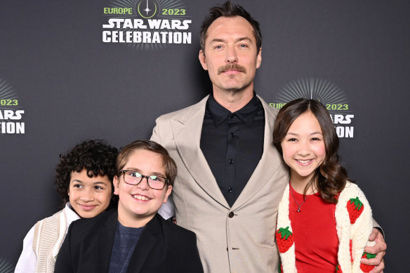 Jude Law with co-stars in Star Wars: Skeleton Crew (from left) Ravi Cabot-Conyers, Robert Timothy Smith and Kyriana Kratter at last year’s Star Wars Celebration in London.