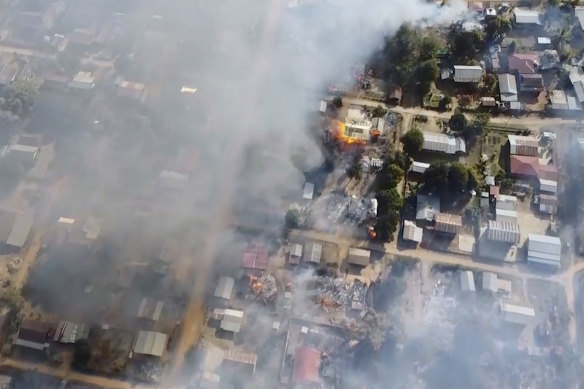 In this image taken from drone video provided by Free Burma Rangers, smoke arises from burning buildings in Waraisuplia village in Kayah State, Myanmar on February 18.