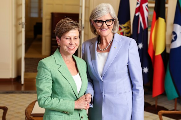 Senator Jenny McAllister, left, being sworn in as the new NDIS minister in the Labor government.