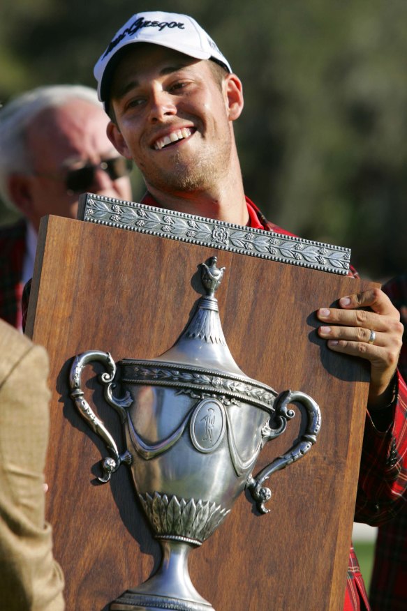 Aaron Baddeley, holds the trophy as he wins the final round of the Heritage Golf tournament in 2006.