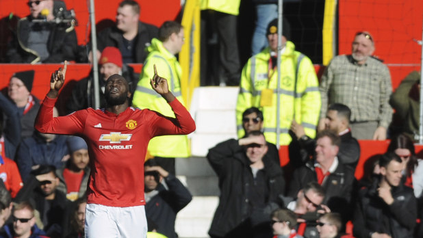 Manchester United's Romelu Lukaku celebrates after inflicting pain on his old club Chelsea at Old Trafford on Sunday.