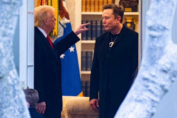 Elon Musk and Donald Trump speak in the White House in March.