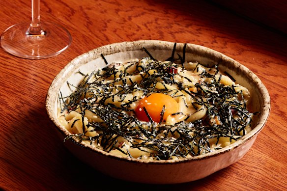 The miso-y udon carbonara towsthe line between Japanese and Italian, with a shoyuzuke (soy-sauce pickled) egg yolk.  