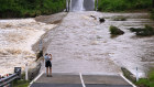 The Coomera River cuts off Clagiraba Road on the Gold Coast on Tuesday.