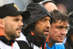 Wests Tigers coach Benji Marshall (second from left) on the bench in Tamworth.
