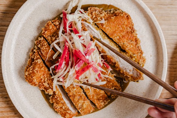 Chicken katsu with Japanese curry sauce and slaw is paired with pale ale at Benchwarmer.