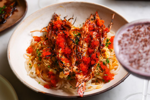 Chargrilled king prawns are tossed with a bisque-like sauce hit with crab fat (roe) and calamansi.