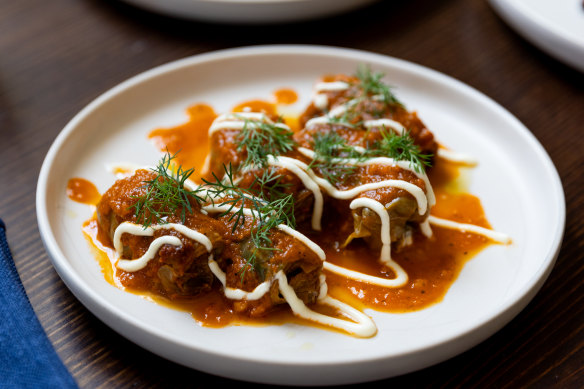 Porcini-stuffed cabbage rolls in roasted tomato sauce.