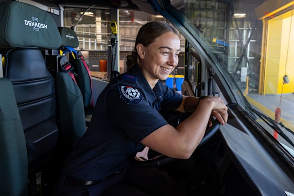 Firefighter Amber Murphy behind the wheel of one of the new state-of-the-art trucks at Western Sydney Airport.
