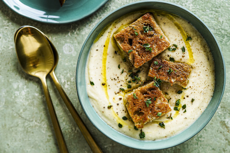 Cauliflower, thyme and potato soup with cheesy mustard croutons.